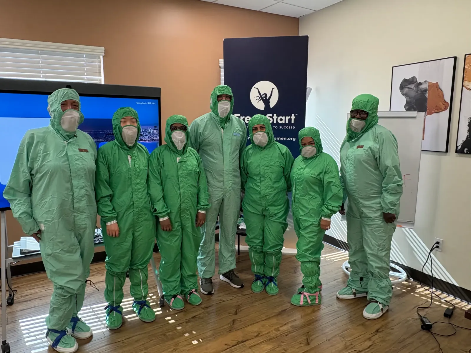 Fresh Start Women’s Foundation cohort in cleanroom suits during semiconductor training